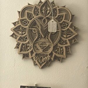 A, powerful lion,out of basswood to be true conversation piece on any wall